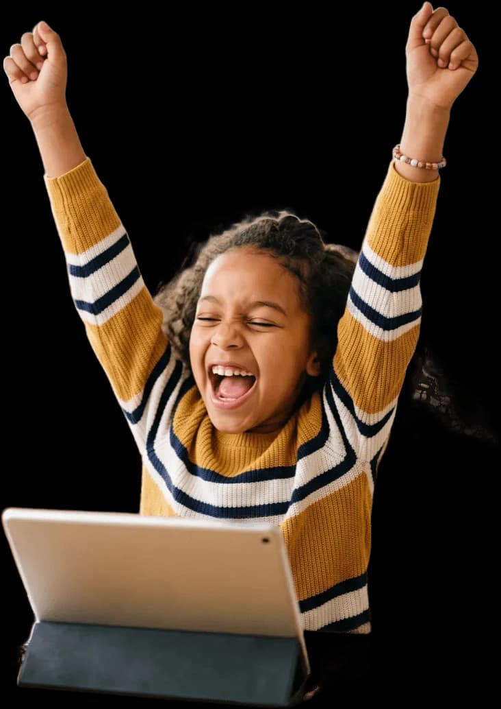 Two children laughing together over a tablet